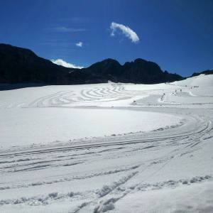 The cross country ski tracks on the Dachstein glacier on a sunny morning